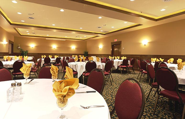 Event space with round tables and chairs