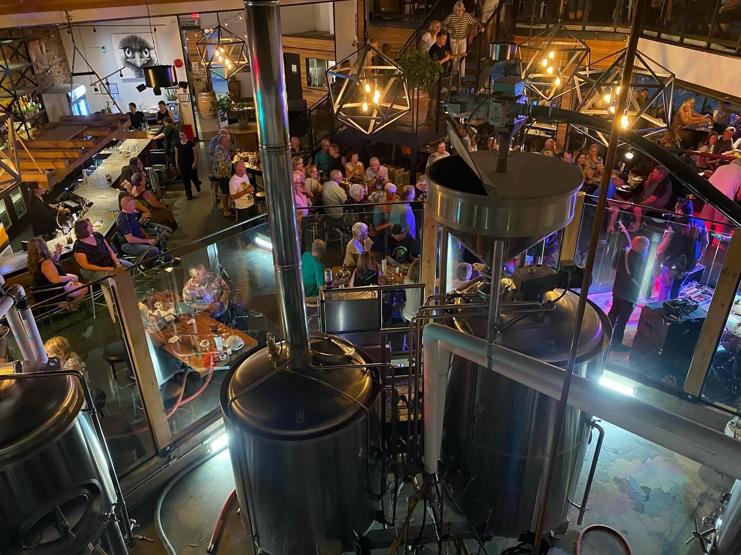 event happening at brewery with live music and a full house